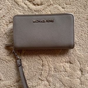 Gray Michael Kors wristlet.
